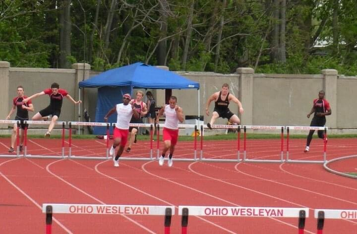 Wabash teammates competing in a hurdles race.