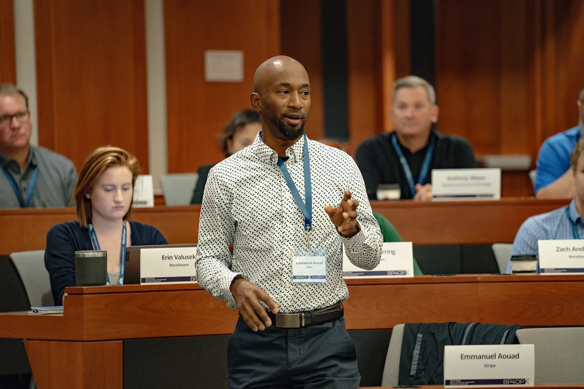 Emmanuel Aouad speaking on a conference panel.